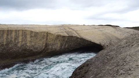 S'Archittu cliffs in a grey mistral storm Stock Footage 105349233