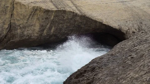 S'Archittu cliffs in a grey mistral storm Stock Footage 105349254