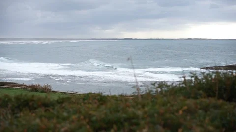 S'Archittu cliffs in a grey mistral storm Video stock 105349259
