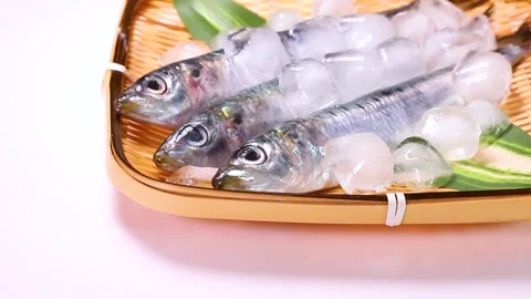 Sardines on a bamboo colander, rotating Stock Footage 322039929
