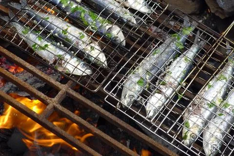Sardines on bbq Stock Photos
