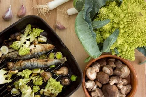 Sardines with vegetables Stock Photos