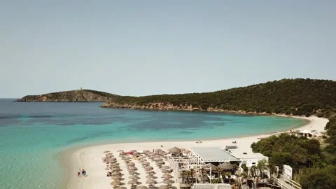 Sardinia: aerial view of umbrellas on a white beach Stock Footage