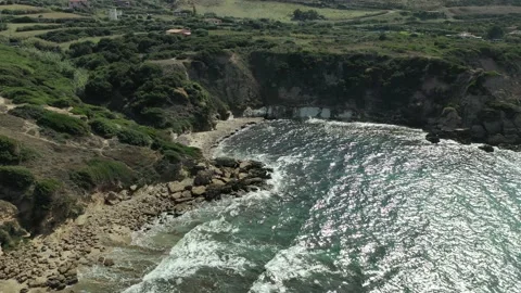 Sardinia Beach Beautiful Tilt-Up Reverse Drone Clip of Rocky North Coast 4K Stock Footage 196655945