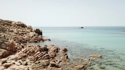 Sardinia: flight over white beach, rocks and turquoise sea 動画素材 155223594