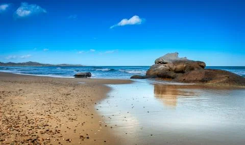 A Sardinian beach with rocks Stock Photos