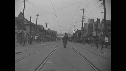 SARIWON - 1950 - First Cavalry soldiers walk through the streets of Sariwon, Stock Footage 277273600