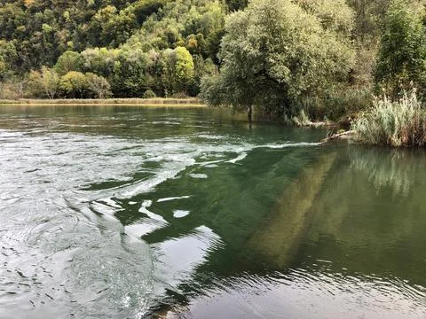 The Sarner Aa river or Sarneraa Fluss by the lake Alpnachersee, Alpnach Stock Photos