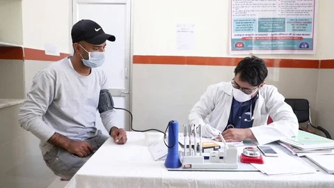 SARS-CoV-2, New strain of Coronavirus, Doctor wearing mask check patient, Stock Footage 126745043