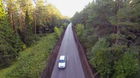 Сars on the road in the forest, aerial view Stock Footage 63457487