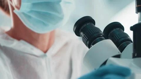 SARS virus under the microscope, in a study to understand its structure Stock Footage 336583551