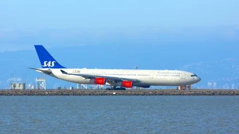 SAS Scandinavian Airbus A340 Taxiing Across San Francisco Bay Stock Footage 123269325