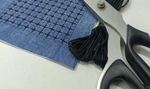 Sashiko embroidery sample with thread and scissors Stock Photos