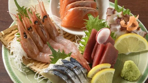 Sashimi Assortment With Lemon Garnish, Close-Up Stock Footage 343693997