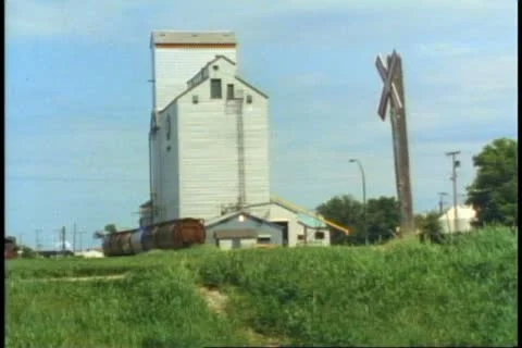 SASKATOON, SASKATCHEWAN, 1990, Square metal Canadian grain elevator Stock Footage 20485239