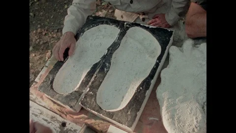 Sasquatch footprints displayed on table, 1970s Stock Footage 90728237
