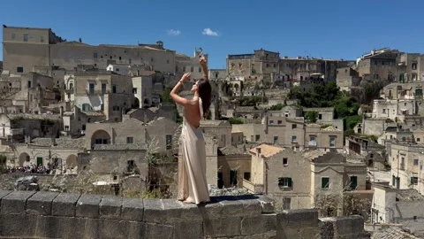 Sassi di Matera Panorama with Elegant Woman Italy Stock Footage 336672927