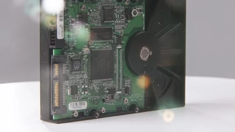 SATA disk drive to inside internal computer drives disc lens flare blur Stock Footage 329708287