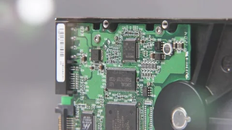 SATA disk drive to inside internal computer drives disc lens flare blur Stock Footage 329708334