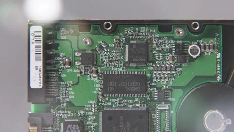 SATA disk drive to inside internal computer drives disc lens flare blur Stock Footage 329708348