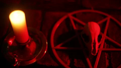 Satanic candle skull weird cult occult Stock Footage
