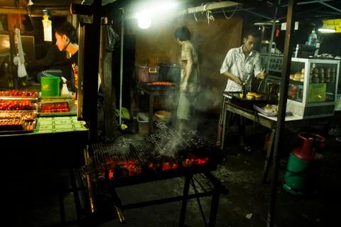 Satay on a grill Stock Photos