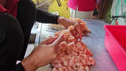 Satay piercing process Stock Footage 252884397