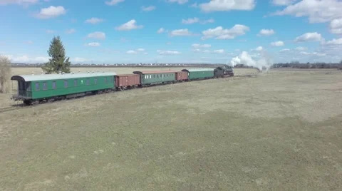 Сatch up and overtaking old steam train Stock Footage