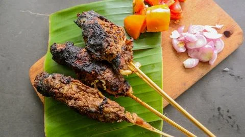 Sate buntel or satay buntel is satay made from minced mutton wrapped in mutto Stock Photos