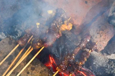 Sate or satay or sometimes written satai is food made ??from pieces of meat.. Stock Photos
