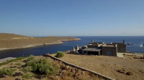 Satellite aerial view stone acritecture with sea view Cyclades summer island Video stock 55534140