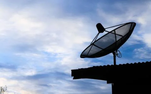 Satellite communication disk on evening background Stock Photos