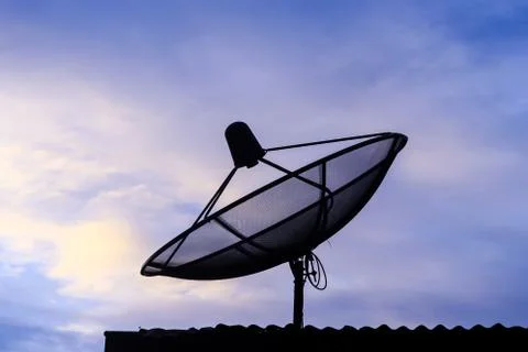 Satellite communication disk on evening background Stock Photos