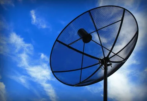Satellite communication disk on sky background Foto stock