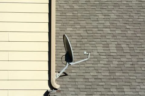 Satellite disc antenna on side of building Stock Photos
