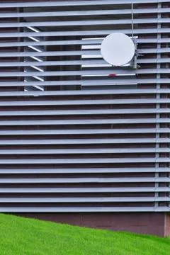Satellite dish on the grid construction close-up Stock Photos