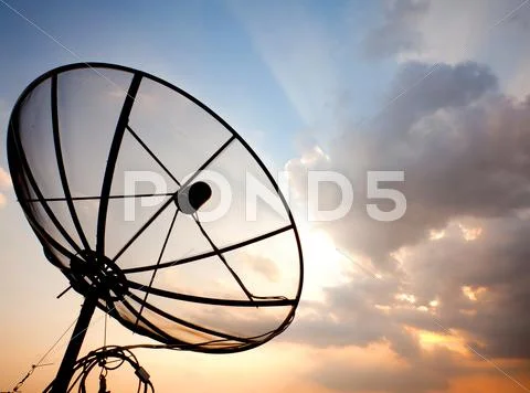 Satellite dish over sunset sky Stock-Fotos