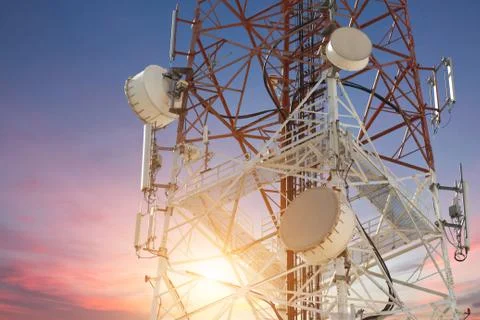 Satellite dish telecom tower at sunset Stock Photos