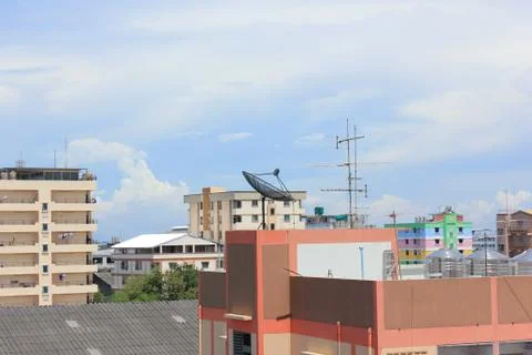 Satellite dish on the top of building Stock Photos