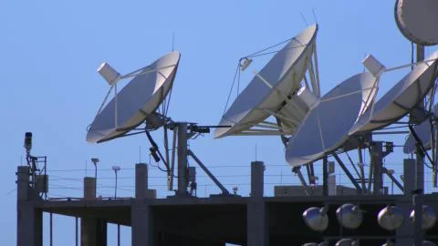 Satellite Dishes Array on a Rooftop Stock Photos