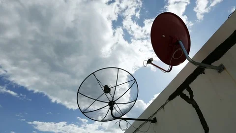 Satellite dishes communication technology network with sun and white cloud Stock Footage 76688770