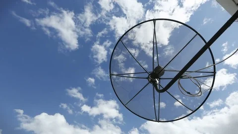 Satellite dishes communication technology network with sun and white cloud Stock Footage 76688845