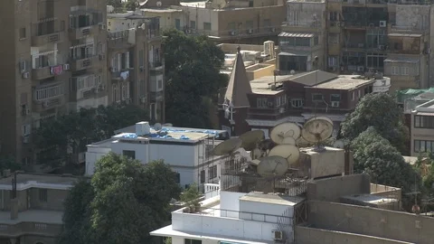 Satellite dishes on rooftops in Cairo Video stock 86891381