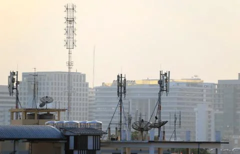 Satellite dishes on rooftops Stock Photos