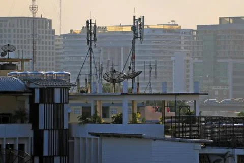 Satellite dishes on rooftops Stock Photos