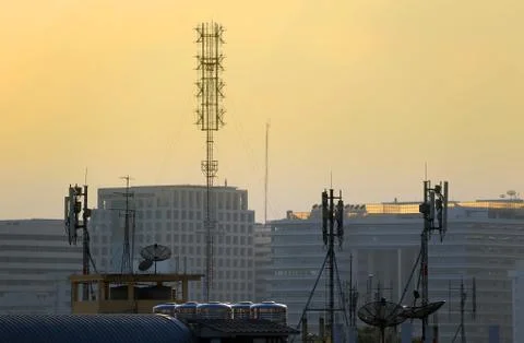 Satellite dishes on rooftops Stock Photos