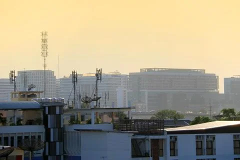 Satellite dishes on rooftops Stock Photos