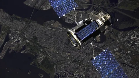 Satellite flying in outer space over a city. Modern spacecraft. 스톡 동영상 112864059