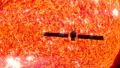 Satellite passes the sun in silhouette HD Footage