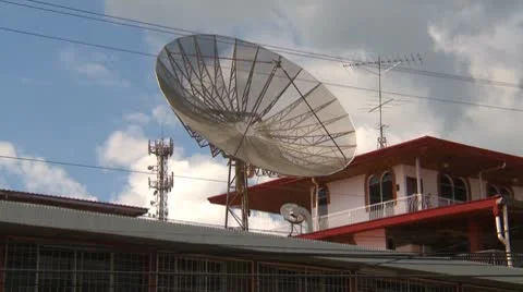 Satellite TV and microwave on roof of buildings Stock Footage